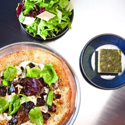 SEASONAL MENU: Chef Matthew Dugan (Shawn’s brother) brings an impressive culinary resume including working as a chef at the famous French Laundry. Some of his menu items include this Black Forest Bacon pizza, housemade focaccia, and a Central Coast Winter lettuce salad with a house vinaigrette. - PHOTO BY STEVE E. MILLER