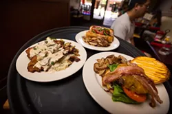 A BURGER OR A BRAT: Burgers, bratwurst, and schnitzel (breaded and fried tenderized pork loin topped with mushroom Jagr sauce) is served at Wineman - GrillHause at 851 Higuera St. in downtown SLO. - PHOTO BY KAORI FUNAHASHI