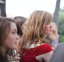 A FACE IN THE CROWD : One of Joe’s models looks on with rapt attention. - PHOTO BY GLEN STARKEY