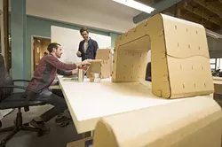 NOT JUST PAPER: From left, “Cardboard Guys” Jake Disraeli (left) and Justin Farr (right) work on their startup at SLO HotHouse. - PHOTO COURTESY OF SLO HOTHOUSE