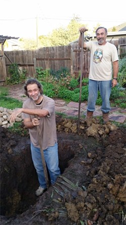DIGGING THE PIT:  Ray Lee (left) and Keith Pellemeier helped dig the roasting pit. - PHOTO BY GEORGE GRIFFIN AND GLEN STARKEY