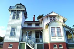 HAUNTED LIGHTHOUSE?: The 1890 lighthouse keeper’s quarters and light tower may look picturesque during the day, but restoration workers reported hearing spirits at the site, prompting the CCPI’s investigation. - PHOTO BY RHYS HEYDEN