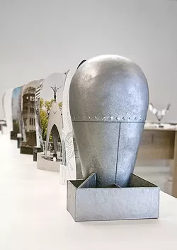 BOOKS, NOT BOMBS! : Leslie Stone’s bomb-shaped book makes a pacifist statement at this year’s “Artists’ Books exhibit,” held at the Cuesta College Art Gallery. - PHOTOS COURTESY OF DAVE PROCHASKA