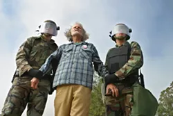 PROTESTING WAR : March 27, 2003. Sanderson Beck protests at Vandenberg Air Force Base. - PHOTO BY CHRISTOPHER GARDNER