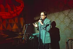ROCK THE MIC: Kreuzberg Lounge’s weekly open mic night turned two years old late last month and continues to unfold each Wednesday from 9 to 11 p.m. hosted by Mitchell Shira (pictured). - PHOTO BY KAORI FUNAHASHI