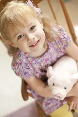 MY LEFT EAR : Four-year old Sienna has unilateral hearing loss and uses one ear to hear. - PHOTO BY STEVE E. MILLER