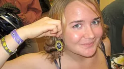 EYE-CATCHING ACCESSORIES : Emma Teixeira hammered the hell out of beer caps to make a pair of earrings anyone can thirst over. - PHOTO BY NICK POWELL