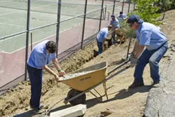 MEN AT WORK : Inmates at the SLO County Jail’s Honor Farm spent a day out in Santa Margarita on May 13, installing a drainage system for the Community Center as part of a pilot program to start an afterschool program for local kids. - PHOTO BY STEVE E. MILLER