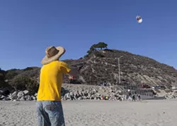 HIGH AS A ...: Aaron Lockwood, who was part of Maeva and Aileen’s wedding ceremony the day before Bill Murray’s birthday, mastered the art of kite flying with only a few near-fatalities. - PHOTO BY COLIN RIGLEY