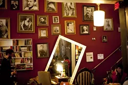 BOOKENDS : Kreuzberg’s couches are rarely empty, and patrons of all ages can find something to sip and read. - PHOTO BY STEVE E. MILLER