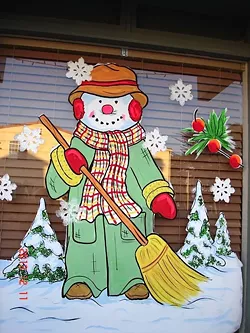 BUNDLED UP: You can see the variety in window painting styles with Marilyn Seim’s own snappily dressed snowman. - PHOTO COUIRTESY OF MARILYN SEIM
