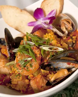 TRY IT : Chef Everett Walcott’s signature dish, The Sea Venture, includes paella and cioppino. - PHOTO BY STEVE E. MILLER