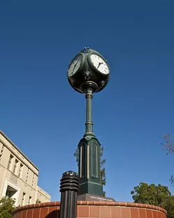 BULBOUS: In an intriguing takedown of the Volny Heritage Clock, which stands on the corner of Osos and Monterey Streets, political science major Lily Meryash humorously describes its “bulbous clock head” which “shoots up petrified as if caught somewhere it knows it’s not supposed to be.” - PHOTO BY STEVE E. MILLER