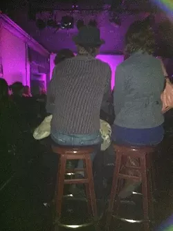 WHAT I SAW : I’m pretty sure some scantily clad women were dancing around in front of me, but mostly I stared at this couple’s back. - PHOTO BY GLEN STARKEYY