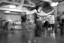 DANCE LIKE NOBODY’S WATCHING : Yum Session dancers experience ecstasy and exercise during weekly freeform dance events on Sunday mornings at the Monday Club. - PHOTO BY STEVE E. MILLER