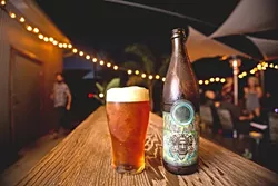 KING OF BEER: BTD’s King Mate IPA is a gateway beer that lures non-IPA drinkers over to the hoppy side while still pleasing the hop-till-you-drop crowd. “It’s an IPA, but it’s a mild one,” Gary said of BTD’s most popular beer. “It’s an English style so it’s got an earthiness to it.” - PHOTO BY KAORI FUNAHASHI