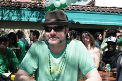 FIXTURE :  Chad Holcomb, a McCarthy&rsquo;s regular, weathers the crowd of amateurs on St. Paddy&rsquo;s Day. - PHOTOS BY GLEN STARKEY