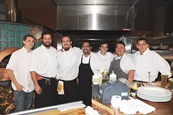 EMBER A-TEAM: (l-r) The Ember team includes Brian Claiborne, executive chef Collins, sous chef David Marks, Adam Aguillon, pastry chef Matt Molacek, Treaver Lynch, and David Kullman. - PHOTO BY DAN HARDESTY