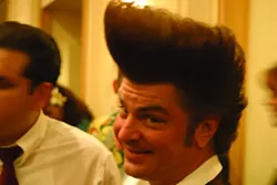 HOW HIGH CAN YOU GO? : People go all out on their hair, like this guy’s pompadour!