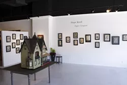 PAPER SURGEON : One of the most intricate pieces in Hope Kroll’s exhibit at Vale Fine Art (pictured) is a fully furnished dollhouse that took the artist 10 years to complete.