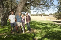 GRAPE MUSIC: Over the shoulders of the Udsen family (Left to Right: Max, Niels, Bimmer, Luke, and Ruby the dog) lies the location of the stage for the Beaverstock music festival at Castoro Cellars. - PHOTO BY STEVE E. MILLER