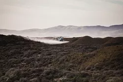 GRASS FIGHT: A helicopter recently circled above the Guadalupe-Nipomo National Wildlife Refuge, spraying an herbicide being tested to manage veldt grass, an invasive species that threatens to adversely impact the dune scrub habitat. - PHOTO BY KAORI FUNAHASHI