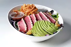 MOTHER MAY I : Mother’s Tavern in SLO is offering up a prix fixe menu with three courses for $30 this January. Get your hands on this crisp sesame-crusted ahi salad with mixed greens, avocado, grilled pineapple, red onion, crispy wontons, and sweet sesame soy dressing with a complimentary 16-ounce beer or glass of wine as part of the deal. - PHOTO COURTESY OF VISIT SAN LUIS OBISPO COUNTY