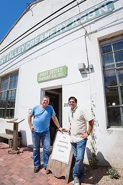 DAIRY LIFE: Third-generation dairy farmer and Harmony Valley Creamery owner Alan Vander Horst (left) aims to restore and refresh Harmony’s historic creamery building with a restaurant serving up Swiss-Italian grub and a creamery shop featuring fresh cheese curds, milk, butter, semi-soft cheeses, and ice cream. Project manager Tom Halen (right) provides the hospitality know-how. - PHOTO BY KAORI FUNAHASHI
