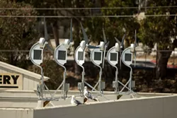 TESTING THE WIND : Crizer Wind Energy, Inc. installed dozens of miniature wind turbines in Morro Bay to test the idealistic but skepticism-inducing claims of DyoCore, a manufacturer now under investigation by the California Energy Commission. - PHOTO BY STEVE E. MILLER