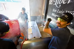 WILD ALES: Libertine Pub Brewer/Owner Tyler Clark is at home brewing in Morro Bay. Not only does the bar and restaurant feature its own wild sour ales, 48 rotating craft beers are also on tap. - PHOTO BY KAORI FUNAHASHI