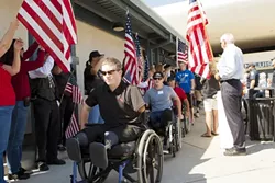 WELCOME! : Wounded American and British war veterans arrived Sept. 25 at the SLO Regional Airport for Operation Surf, a rehabilitative surfing program. - PHOTOS BY STEVE E. MILLER