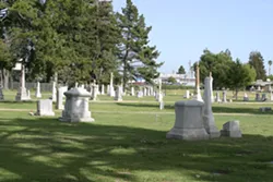 TOO LATE : By the time I left the pool, the American flags decorating the cemetery had been removed - PHOTO BY GLEN STARKEY