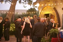DRESS LIKE JOHNNY CASH : Attendees were requested to dress in black, while Joe and his models dressed in red. - PHOTO BY GLEN STARKEY