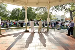 SPEAKING OUT : The Rev. Helen Carrol, left, of the Unitarian Universalist Fellowship in SLO and the Rev. Carol Hall, minister at St. Benedict’s Episcopal Church in Los Osos, address the crowd. - PHOTO BY STEVE E. MILLER