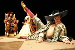 I FEEL PRETTY! : Biscarrat, played by Brandon Howard (foreground), seems to serve no other purpose than to hang out with the King and Queen (Nik Johnson and Fatima Safaverdi, background) while they play cards, but at least he looks good doing it. - PHOTO BY STEVE E. MILLER