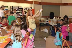 PUTTING THE FUN IN FUNDAMENTALS: In addition to her online science business, Aurora Lipper holds yearly science camps designed to show kids how awesome science is. These camps include activities like building flying contraptions, liquid nitrogen experiments, and laser light shows using optical tables that the students built. - PHOTO COURTESY OF AURORA LIPPER
