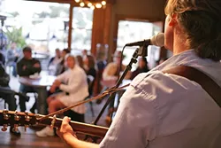 INTIMACY: A small but appreciative crowd eats up Mulgrew’s every word and note during a recent Bang the Drum Brewery performance. - PHOTO BY GLEN STARKEY