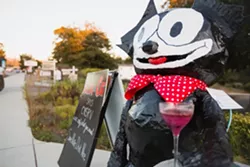 FELIX FELICIS: Felix the Cat, created by Deborah Scarborough, Charlotte Goforth, and Beezie Moore greets guests of the Black Cat Bistro with a message of 'Save Water, Drink Wine.' - PHOTO BY KAORI FUNAHASHI
