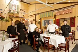 SAY IT WITH SPAGHETTI : Mama’s Meatball staff (l-r) Patrick Parks (server), Ilario De Palo (maitre d'/kitchen Manager), Nicola Allegretta (executive chef and owner), Jackeline Allegretta (catering/owner), Luca Allegretta (sous chef), and Brian Hodge (server) serve up dishes like capricciosa pizza with mozzarella, mushrooms, artichoke hearts, and ham and salmone allo scoglio with grilled salmon, clams, mussels, calamari, shrimp, and fresh tomatoes in white wine sauce. - PHOTOS BY STEVE E. MILLER
