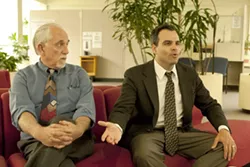 IN IT TO WIN IT : Former medical marijuana collective operator Peter Miller (left) discussed his criminal case with attorney Patrick Fisher before a May 23 pretrial hearing. - PHOTO BY STEVE E. MILLER