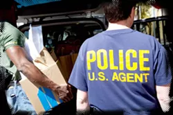 BUSTED : Sheriff’s deputies and federal agents carried out evidence from Compassionate Caregivers in Morro Bay during the March 29 raid, last year. That evidence is being used in Charles Lynch’s federal trial, which began July 22.