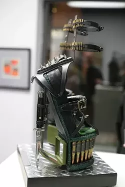 MY FAVORITES! : While the show is chock full of awesome art, my favorite piece was Larry Le Brane’s “Combat Stilettos,” constructed completely by hand of fused glass, switchblade knives, ammo, hardware, found objects, and “G.I. Jane compacts.” - PHOTOS BY GLEN STARKEY