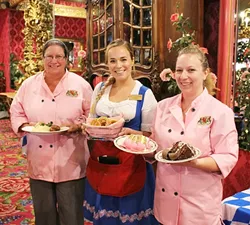 GUTTENTAG: From left, Madonna Inn kitchen manager Jacqui Hanover, server Morgan Enbitt, and assistant kitchen manager Seren Bardwell are ready to serve up German eats and Firestone beer at Madonna Inn’s Oktoberfest this Oct. 2 and 3 at the Expo Center. - PHOTO BY AUDREY PEARCE; COURTESY OF THE MADONNA INN