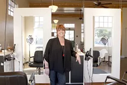 HIGH LIGHTS: Marcia Beck stands by styling stations. - PHOTO BY STEVE E. MILLER