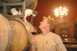 VINTNER DAN STARK AND WINERY CAT: - PHOTO COURTESY OF THE INDEPENDENT MAGAZINE
