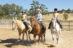 ONE FINE EQUINE : Katie Hill of Three Oaks Ranch provides a well-rounded introduction to horsemanship. - PHOTO BY STEVE E. MILLER