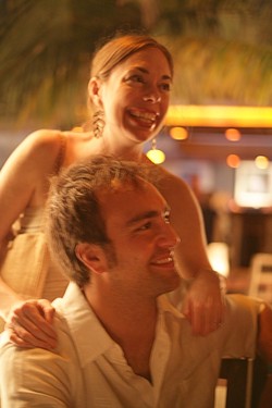 LOVE GLOW :  Rubey and Gabe share a laugh with friends at their rehearsal dinner in Playa del Carmen, Mexico. - PHOTO BY GLEN STARKEY