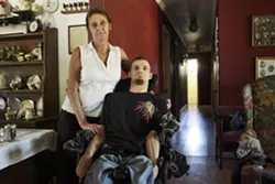 NO MORE ROAD TRIPS : Toni Paradis (left) used to drive her son Matt Green to Oakland to get his medical marijuana because there are no dispensaries in SLO County. Now, they rely on local delivery services to avoid long drives. - PHOTO BY STEVE E. MILLER