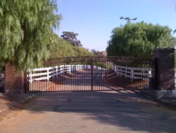 SLO OR SANTA BARBARA : The gate to the Suey Ranch is currently in SLO County, but could become part of Santa Barbara unless one more supervisor protests the transfer. - PHOTO BY COLIN RIGLEY