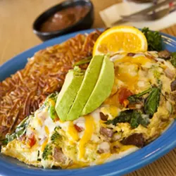 RISE AND SHINE : The vegetarian omelet at Zorro’s is filled with fresh spinach, tomatoes, broccoli, onions, bell pepper, and cheese—plus, it comes with crispy hash browns - PHOTO BY STEVE E. MILLER